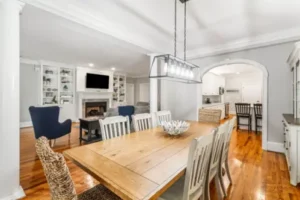 A large dining room table with chairs around it.